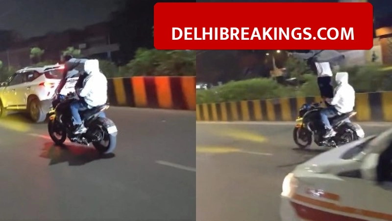 delhibreakings delhi police action against bike stunts viral video challan Delhi Police Identifies Stunters Performing On Moving Bike, Massive Fine Issued After Viral Video
